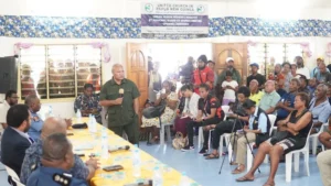 Chairman, Hon. Russell Simon Wavik addressing dignitaries and the community. 